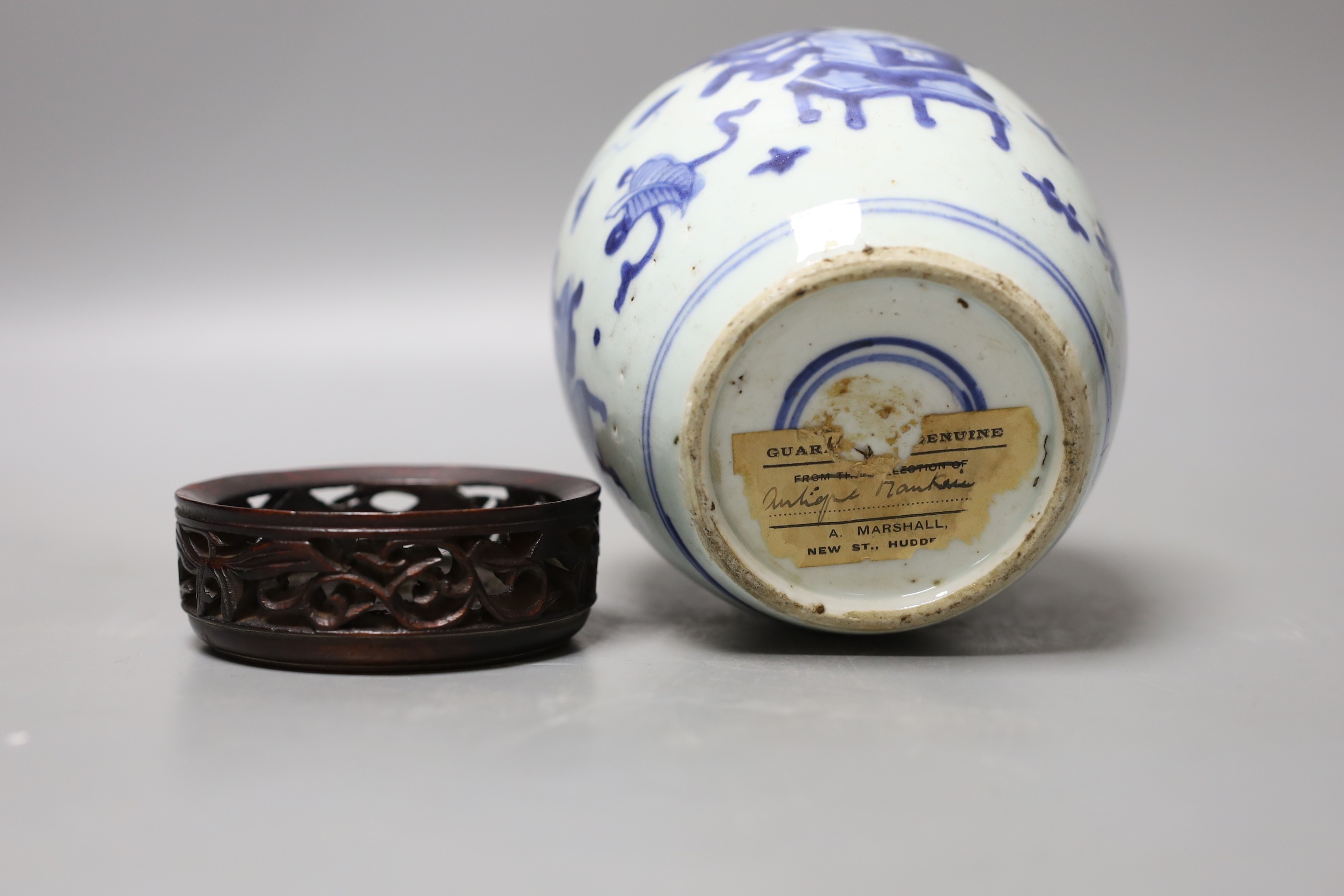 A 19th century Chinese blue and white jar with wood cover - 17cm high